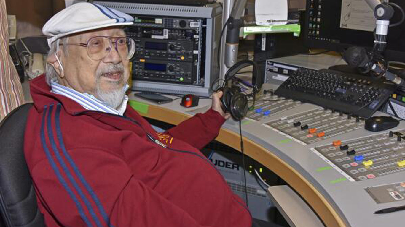 DJ Uncle Ray sitting by his desk studio