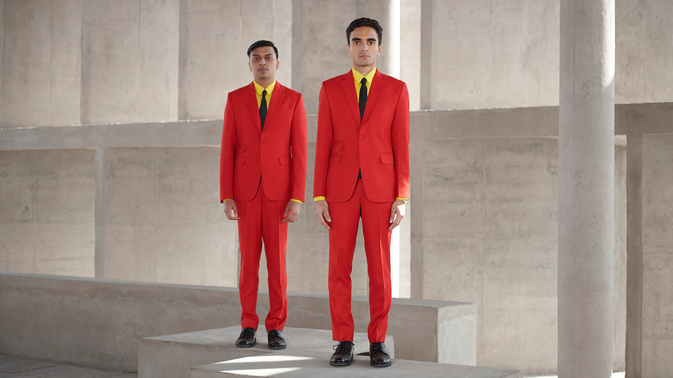 Parekh & Singh in red suits