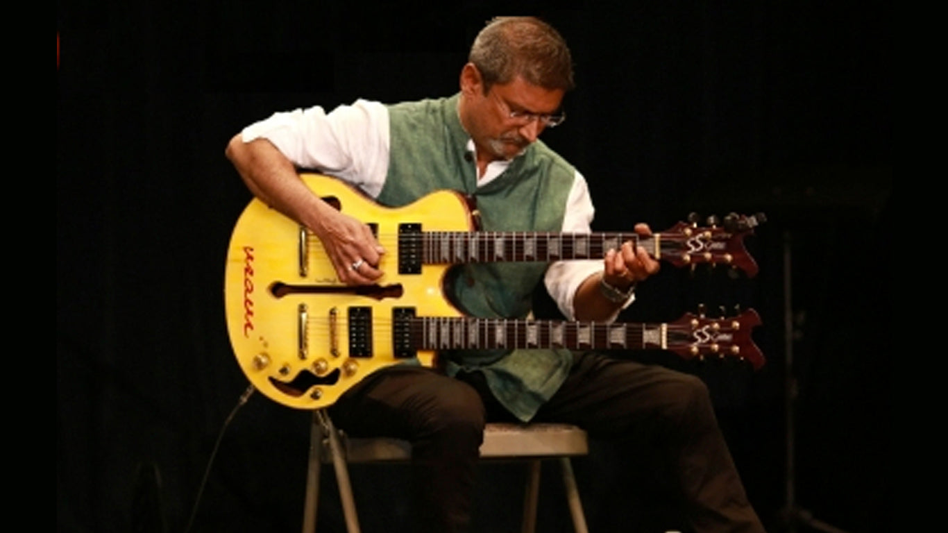 Ravi Iyer playing the guitar