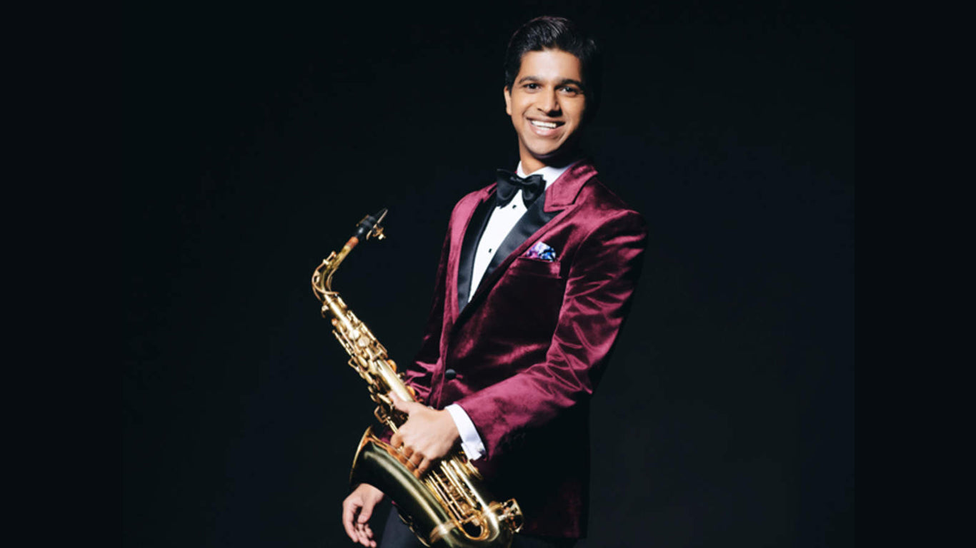 Rhys Sebastian holding a saxophone